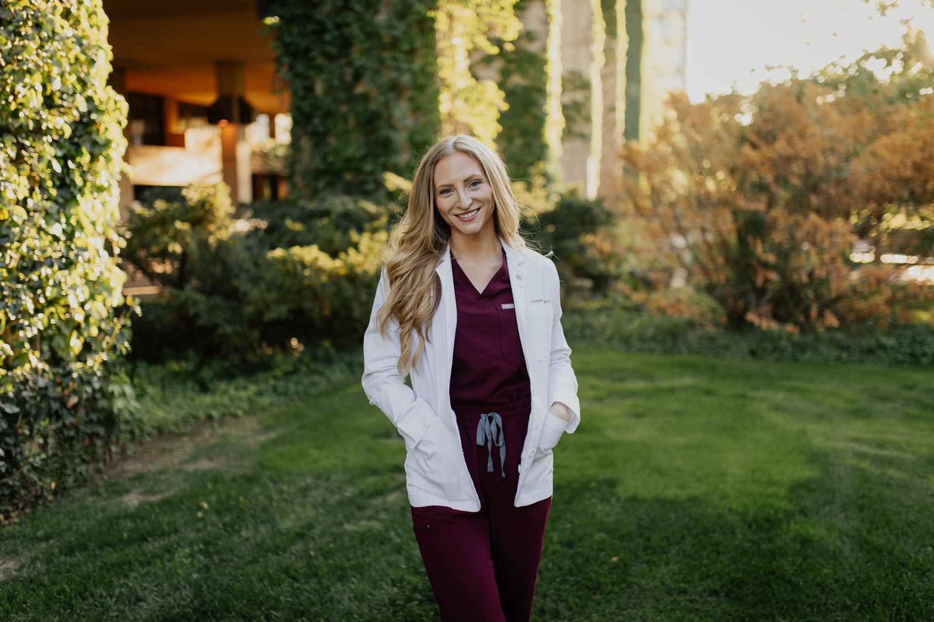 Dr. Lauren Means, Claremore family dentist at First Street Family Dentistry, smiling outside the dental office