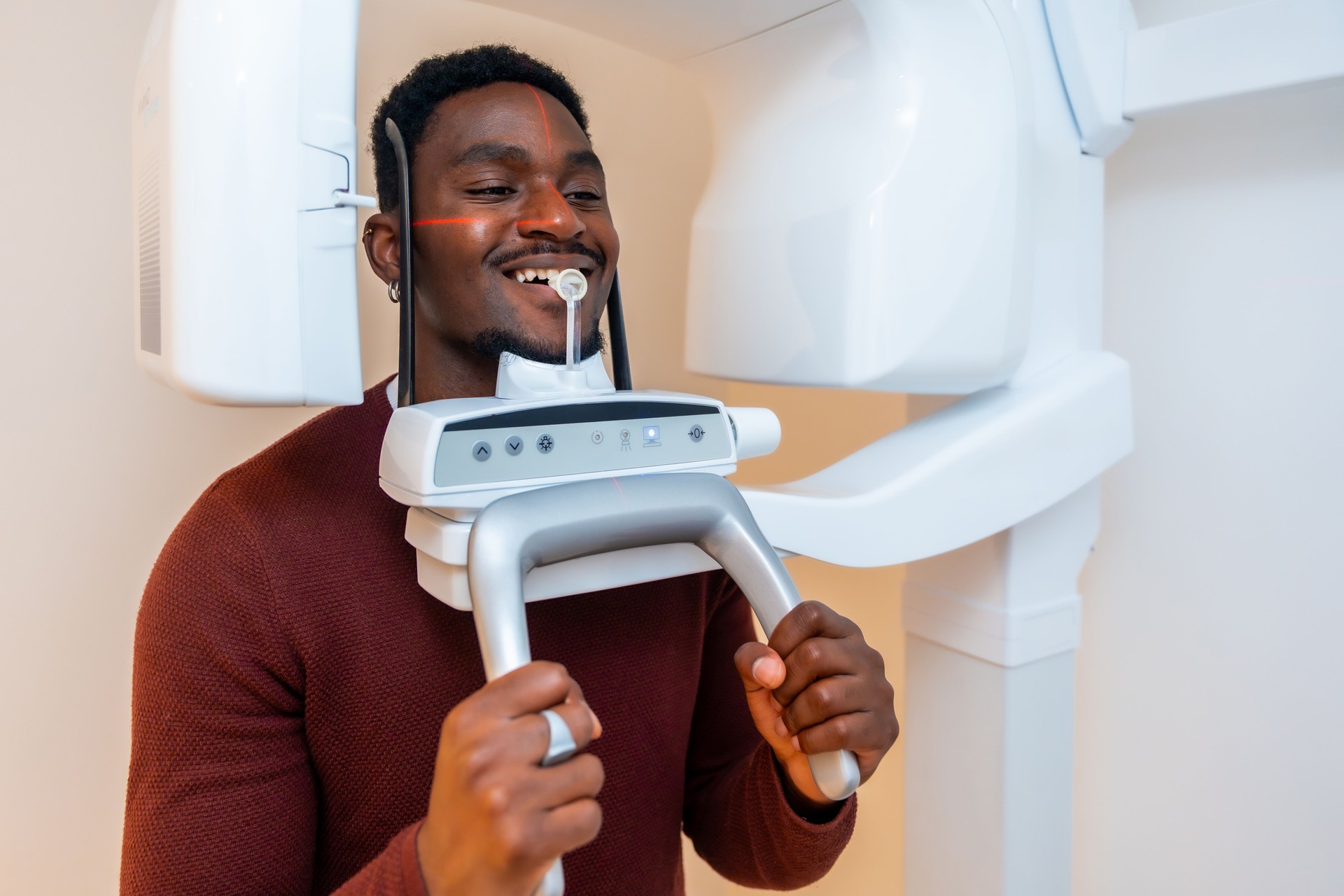 Patient undergoing dental x-ray scanning in modern clinic